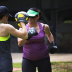 personal trainer teaching boxing exercise